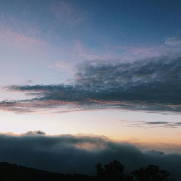 Abstract sunrise over a geometric landscape